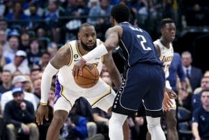 Feb 26, 2023; Dallas, Texas, USA; Los Angeles Lakers forward LeBron James (6) guards Dallas Mavericks guard Kyrie Irving (2) during the fourth quarter at American Airlines Center. Mandatory Credit: Kevin Jairaj-USA TODAY Sports