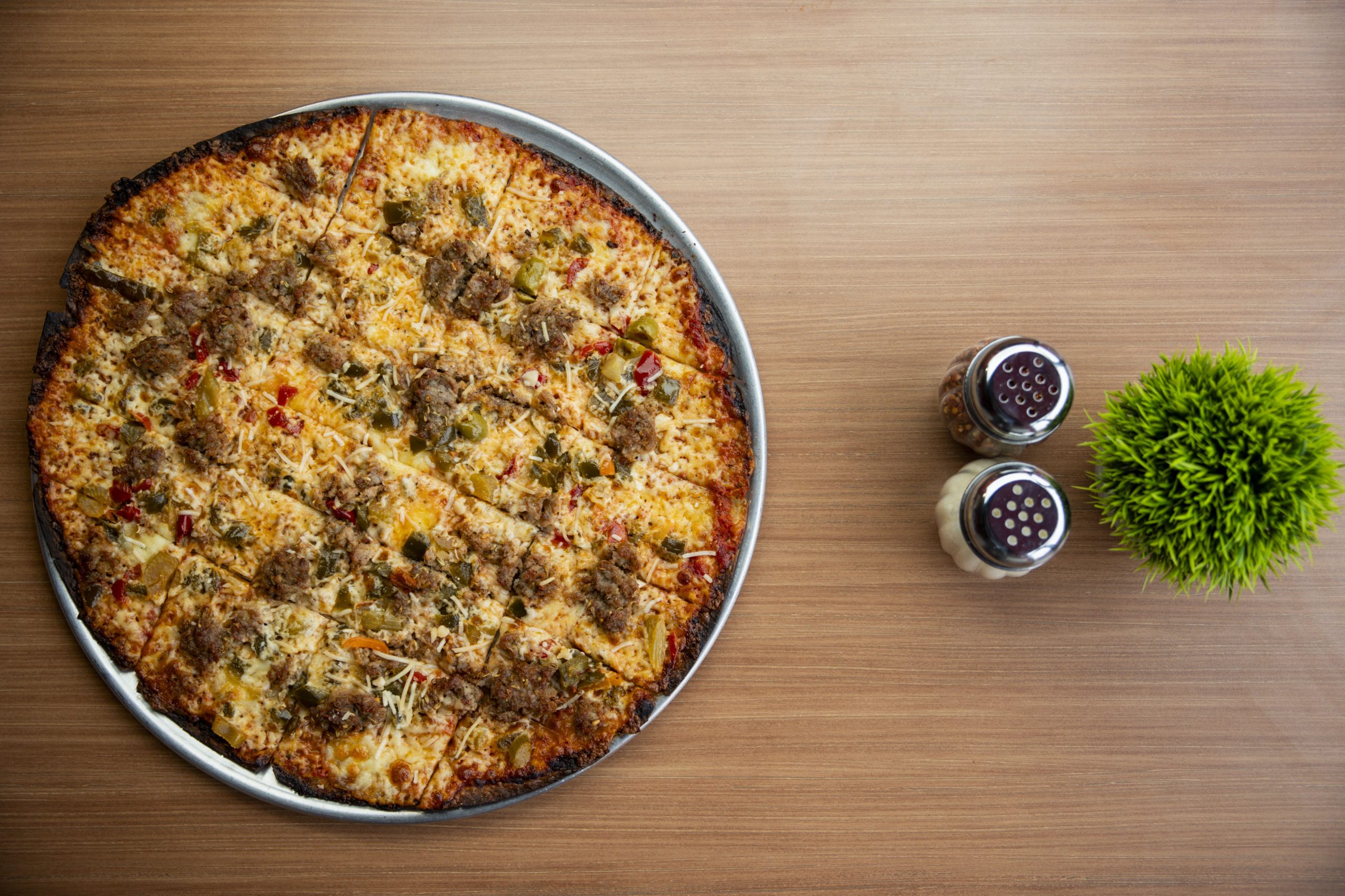 A tavern-style sausage with giardiniera pizza on Jan. 30, 2024,...