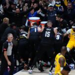 Members of the Denver Nuggets celebrate defeating the Los Angeles Lakers during game two during the 2024 NBA playoffs at Ball Arena.