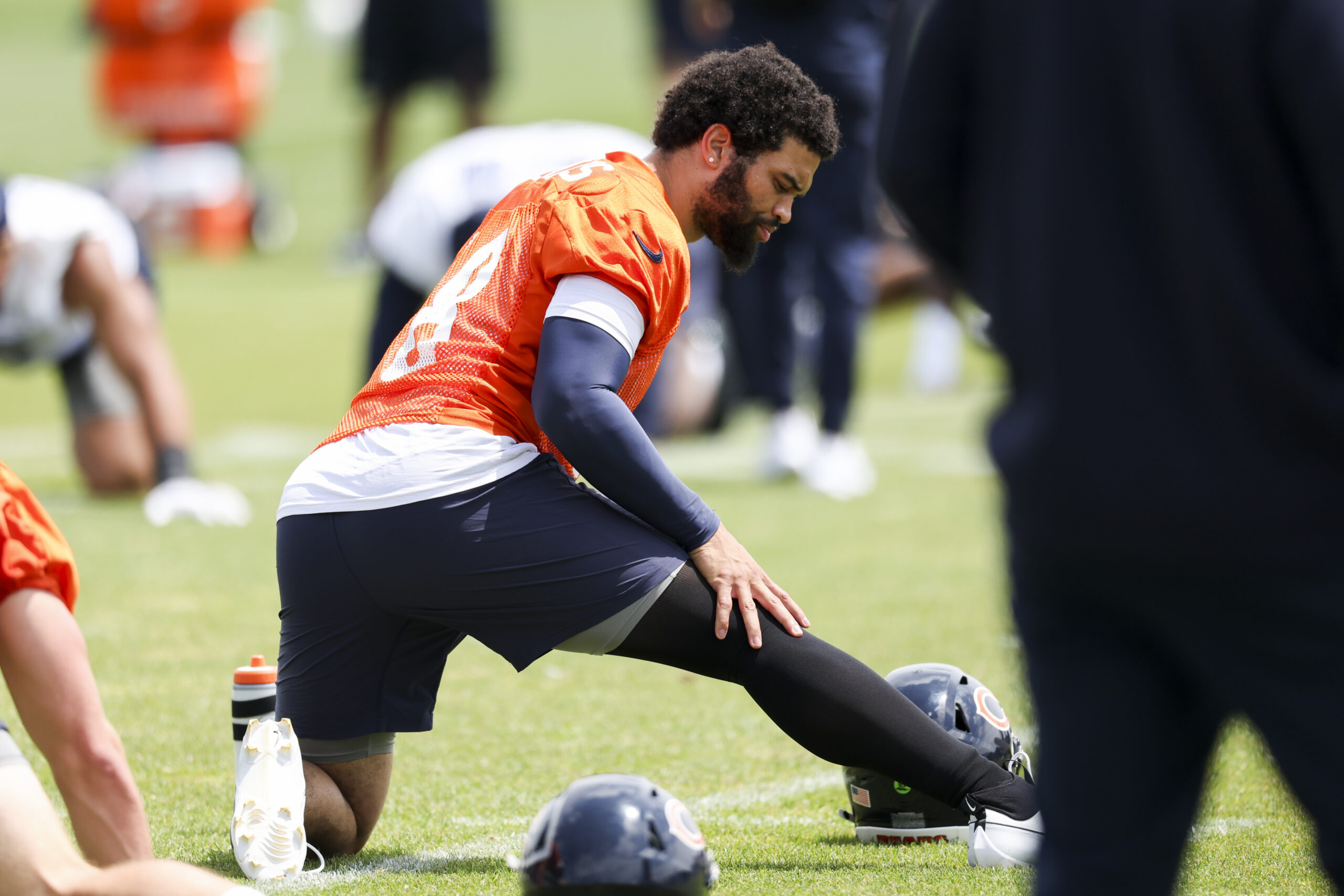 Bears quarterback Caleb Williams stretches during minicamp at Halas Hall...