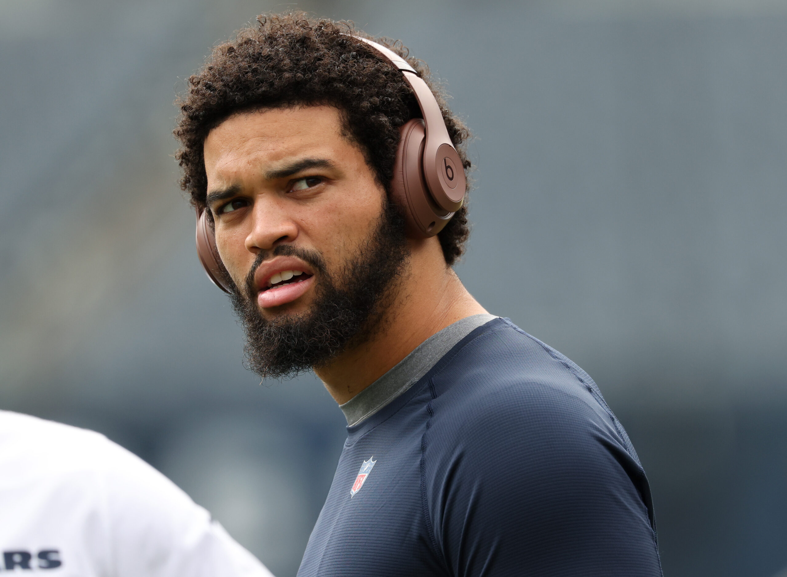 Bears quarterback Caleb Williams warms up for a preseason game...