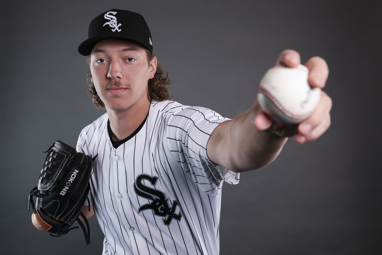 A photo of Hagen Smith at the White Sox picture day posing as if he’s throwing a baseball.