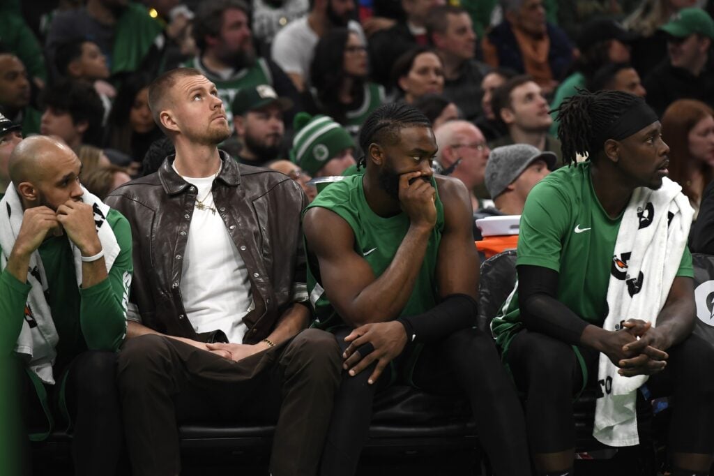 Boston Celtics center Kristaps Porzingis (8) guard Jaylen Brown (7) and guard Jrue Holiday 
