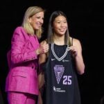 Apr 14, 2025; New York, New York, USA; Kaitlyn Chen poses with WNBA commissioner Cathy Engelbert after being selected with the number thirty overall pick to the Golden State Valkyries in the 2025 WNBA Draft at The Shed at Hudson Yards. Mandatory Credit: Vincent Carchietta-Imagn Images