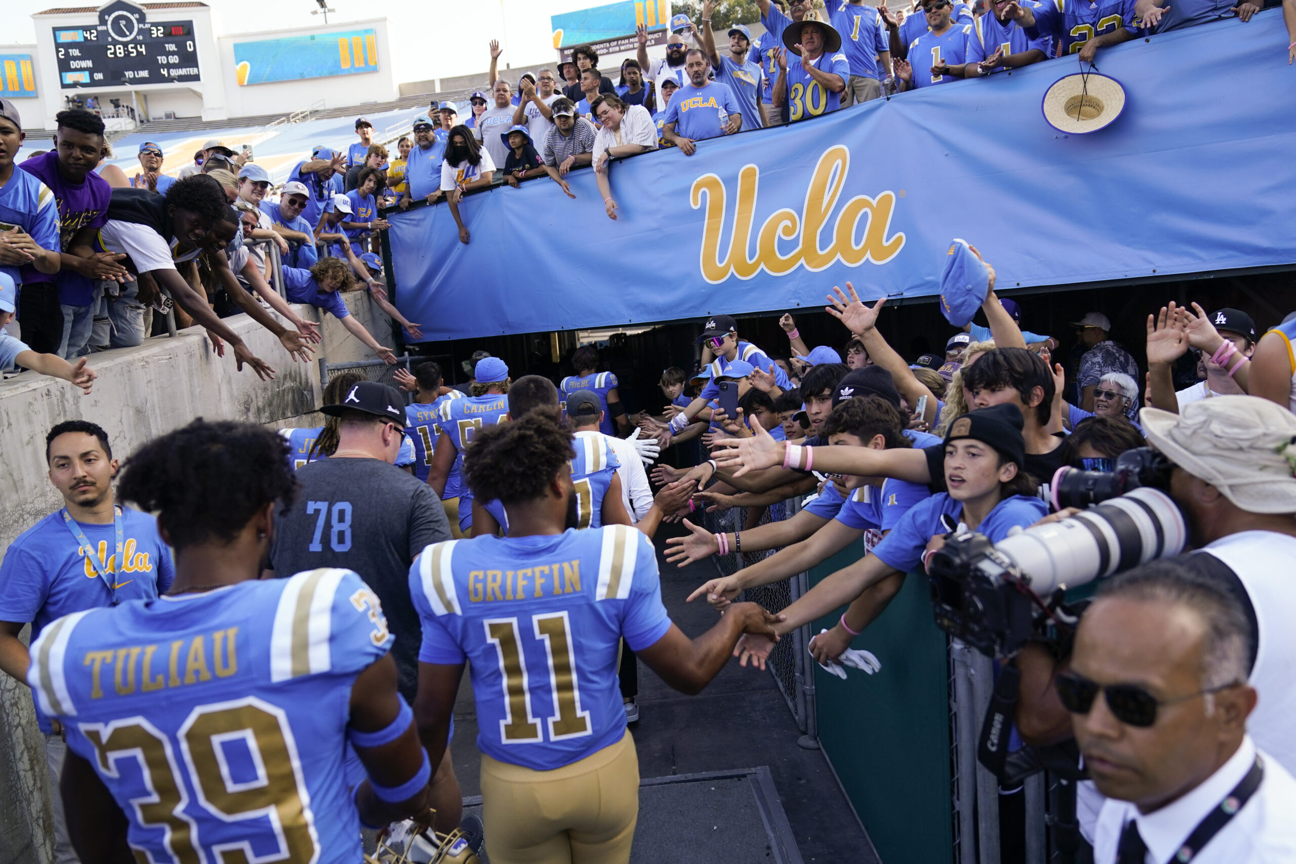 UCLA players greet fans as they leave the field after a 42-32 win over Utah on Oct. 8, 2022, in Pasadena, Calif. UCLA players greet fans as they leave the field after a 42-32 win over Utah on Oct. 8, 2022, in Pasadena, Calif.