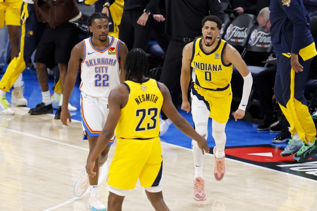 Indiana Pacers guard Tyrese Haliburton (0) and forward Aaron Nesmith (23) celebrate after Haliburton makes the game winning shot as Oklahoma City Thunder guard Cason Wallace