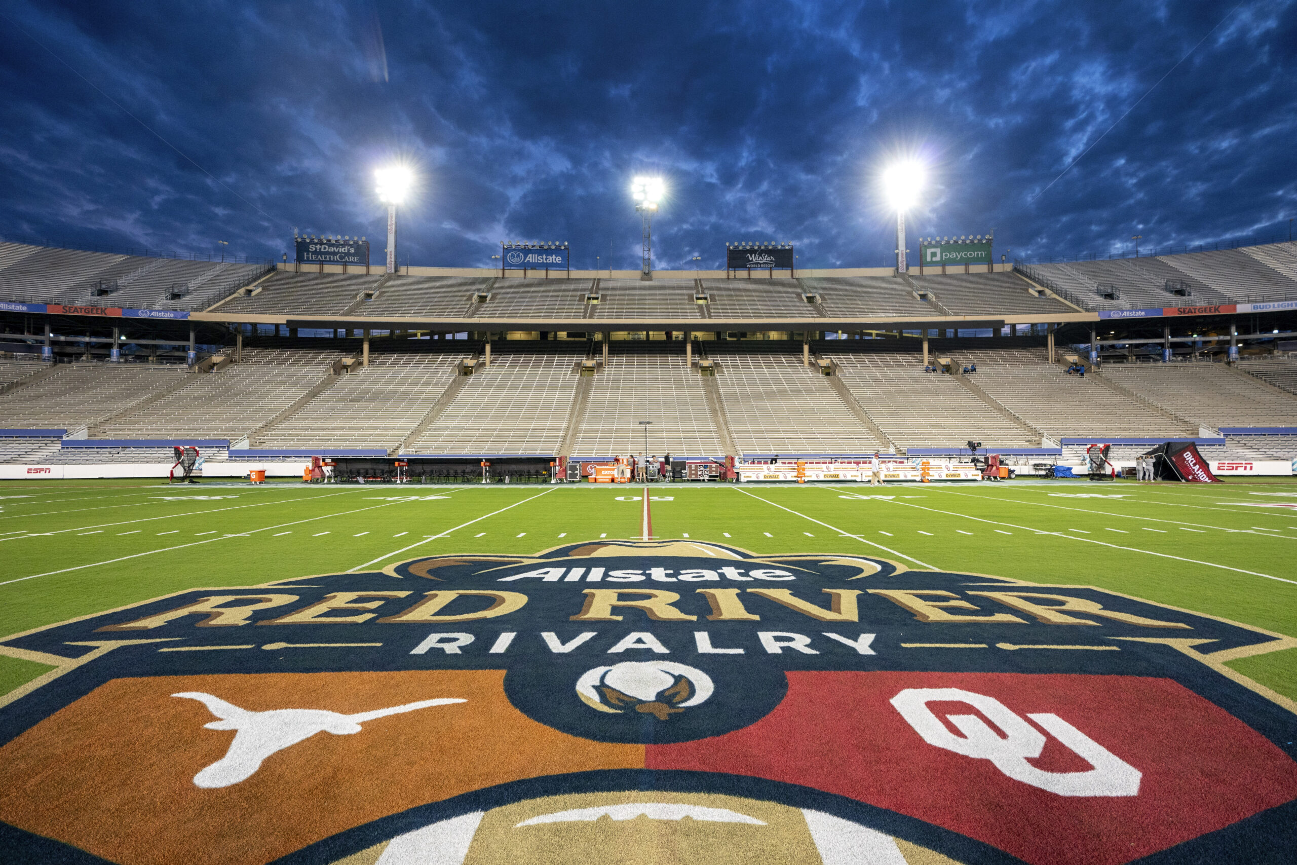 The Texas and Oklahoma logos are painted at midfield before a game at the Cotton Bowl on Oct. 7, 2023, in Dallas. The Texas and Oklahoma logos are painted at midfield before a game at the Cotton Bowl on Oct. 7, 2023, in Dallas.