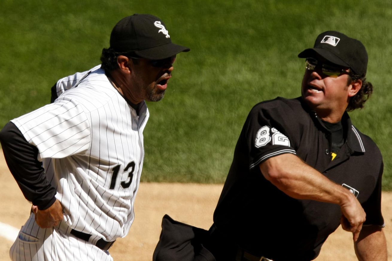 Home plate umpire Rob Drake ejects Chicago White Sox manager Ozzie Guillen, after Guillen argued about the strike zone during the seventh inning against the Texas Rangers. The White Sox defeated the Rangers, 10-8, at U.S. Cellular Field in Chicago, Illinois, Wednesday, July 23, 2008.