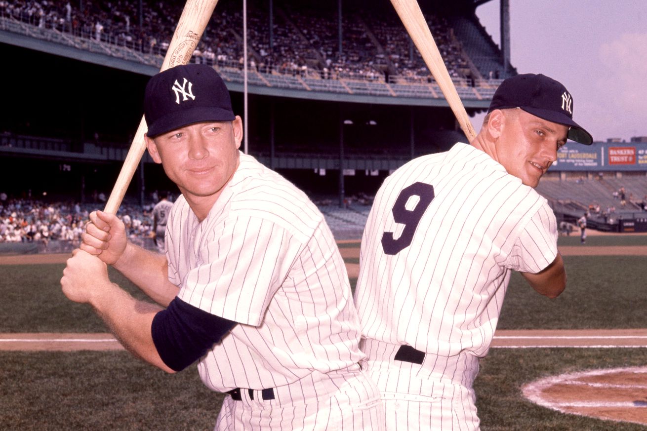 Mickey Mantle #7 and Roger Maris #9 of the New York Yankees pose back-to-back prior to an MLB game against the Chicago White Sox at Yankee Stadium in the Bronx, New York, August 17, 1961.