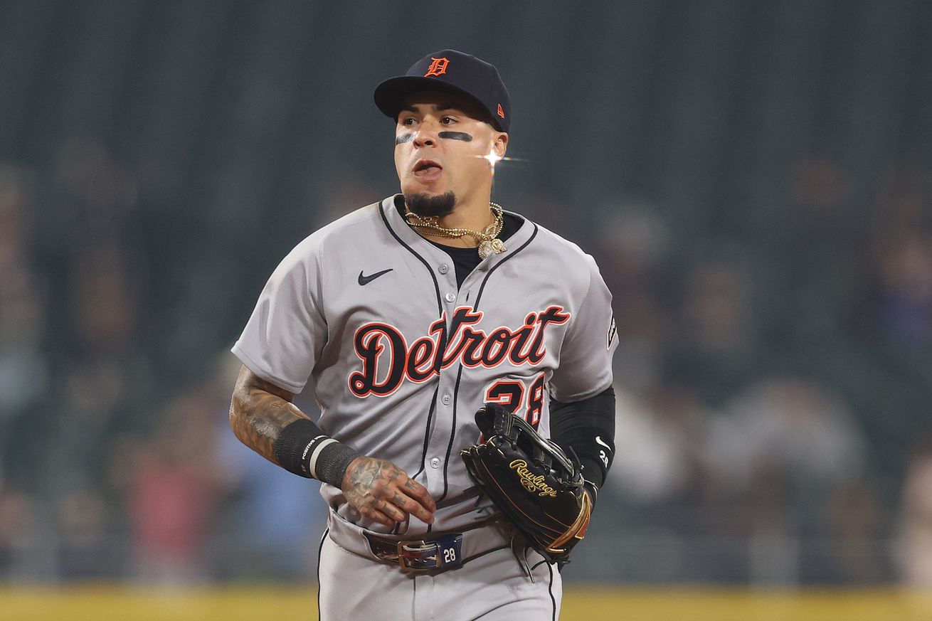 Javier Báez (No. 28) of the Detroit Tigers wears eye black and looks on against the Chicago White Sox at Rate Field on June 4, 2025 in Chicago, Illinois. His earring is catching the ballpark lights in such a way as to appear to be glistening like a starburst.