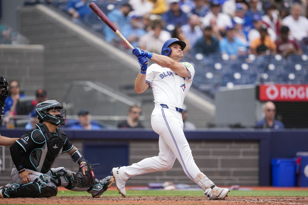 Will Robertson #39 of the Toronto Blue Jays swings against the Arizona Diamondbacks during the seventh inning in their MLB game at the Rogers Centre on June 19, 2025 in Toronto, Ontario, Canada