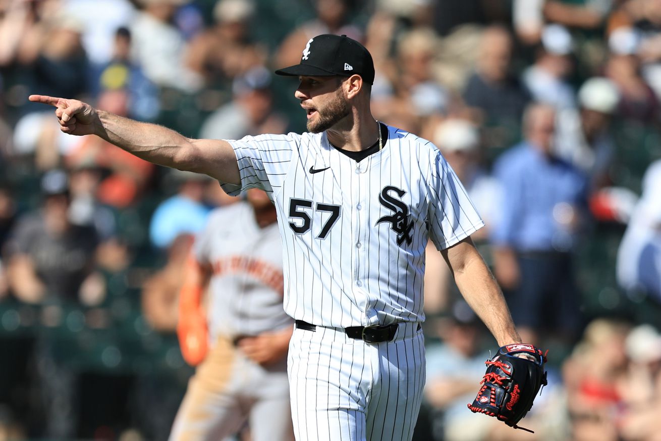 Chicago White Sox pitcher Adrian Houser points with his right hand at catcher Edgar Quero (not pictured), after Quero threw out a baserunner at third base in the sixth inning of a game against the San Francisco Giants at Rate Field on June 28, 2025 in Chicago, Illinois.