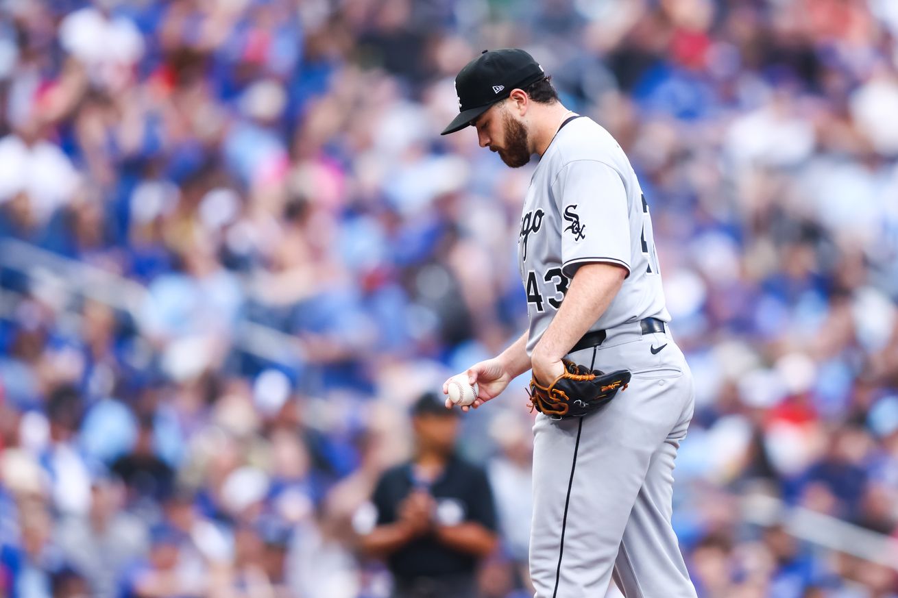 Aaron Civale #43 of the Chicago White Sox looks down at the baseball from the pitcher’s mound during the MLB game against the Toronto Blue Jays at Rogers Centre on June 21, 2025 in Toronto, Ontario, Canada.