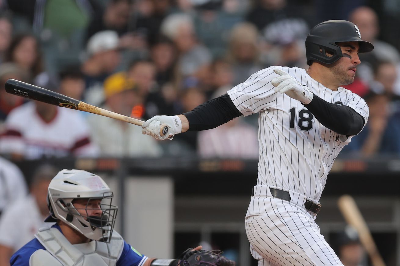 White Sox outfielder, Mike Tauchman, mid-swing vs the Blue Jays at Rate Field on July 7.