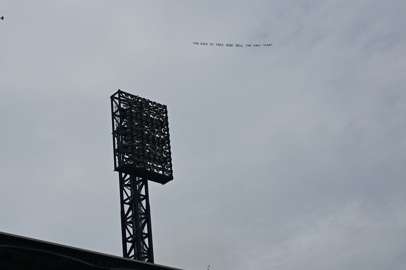 A plane flies a banner about Pittsburgh Pirates owner Bob Nutting before the game between the Pittsburgh Pirates and the Chicago White Sox at PNC Park on July 18, 2025 in Pittsburgh, Pennsylvania.
