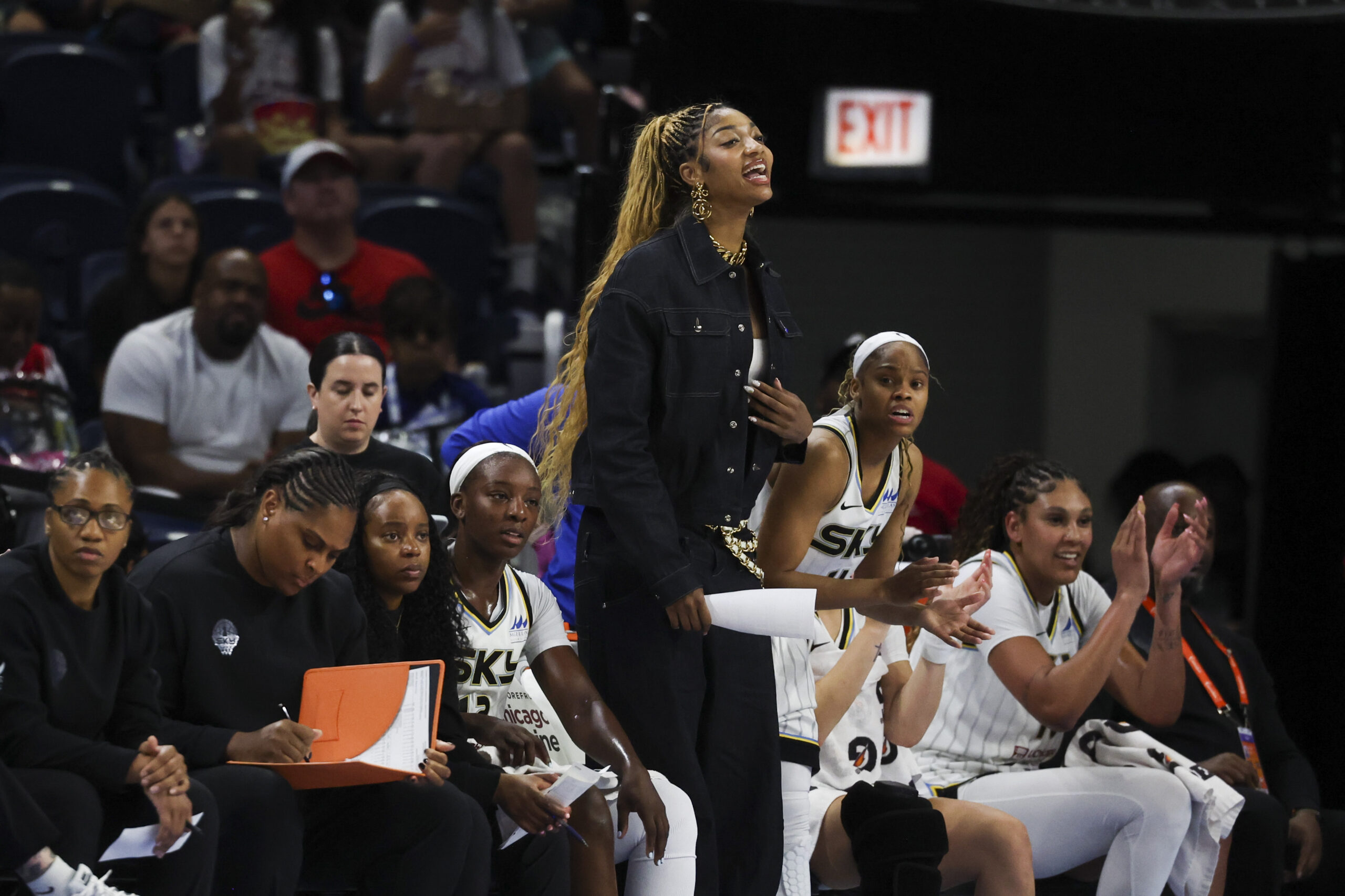 Sky forward Angel Reese cheers for her teammates in the...