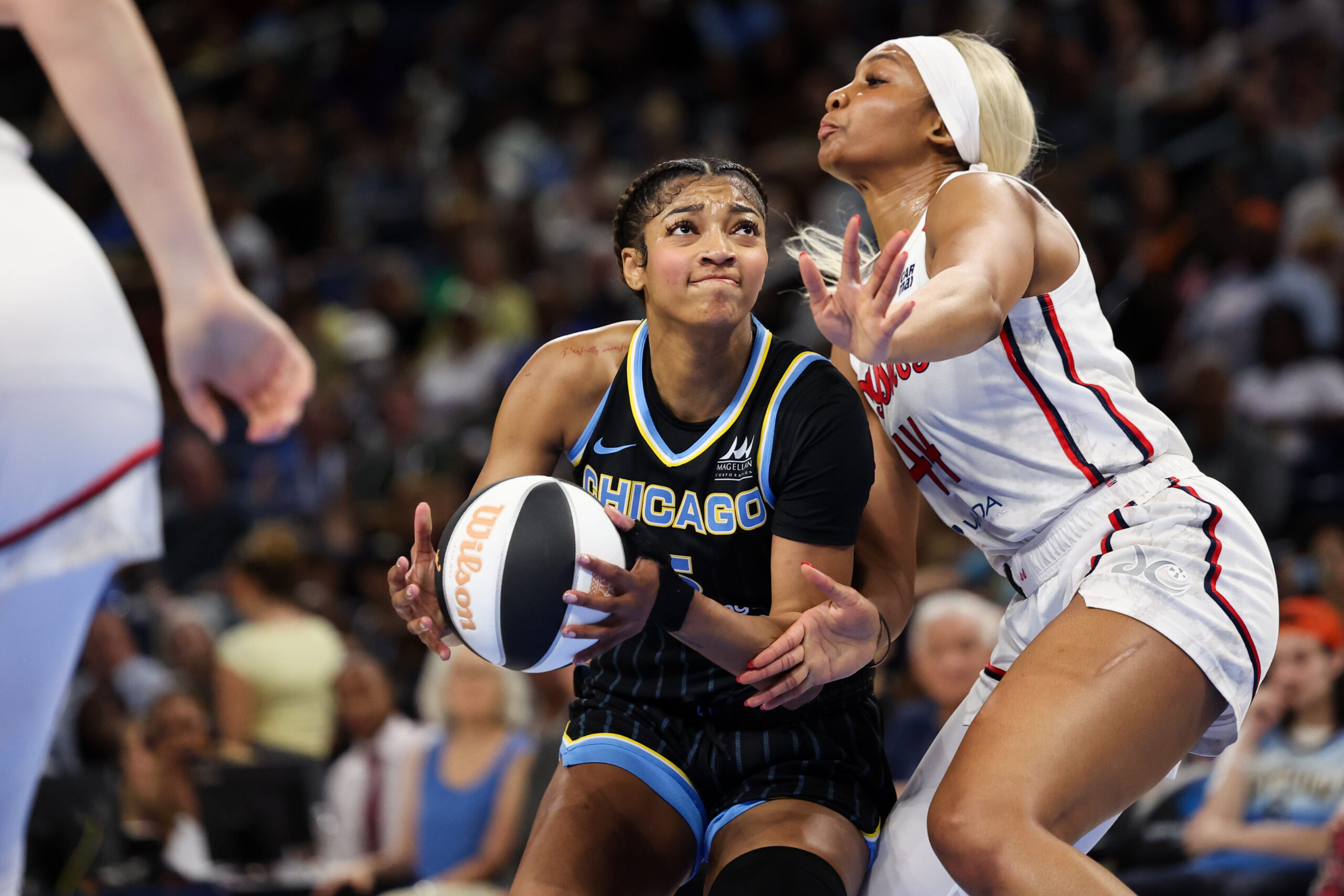 Mystics forward Kiki Iriafen guards Sky forward Angel Reese during...