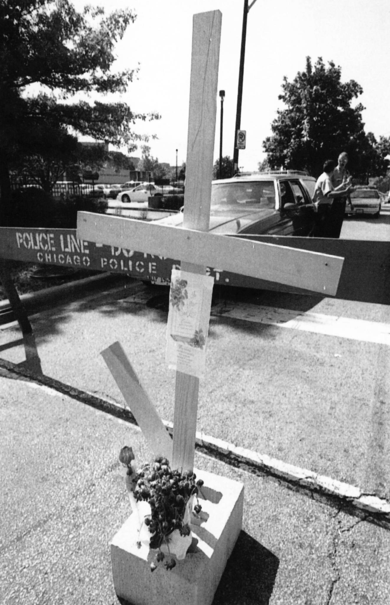 A cross and flowers for those who died during the...