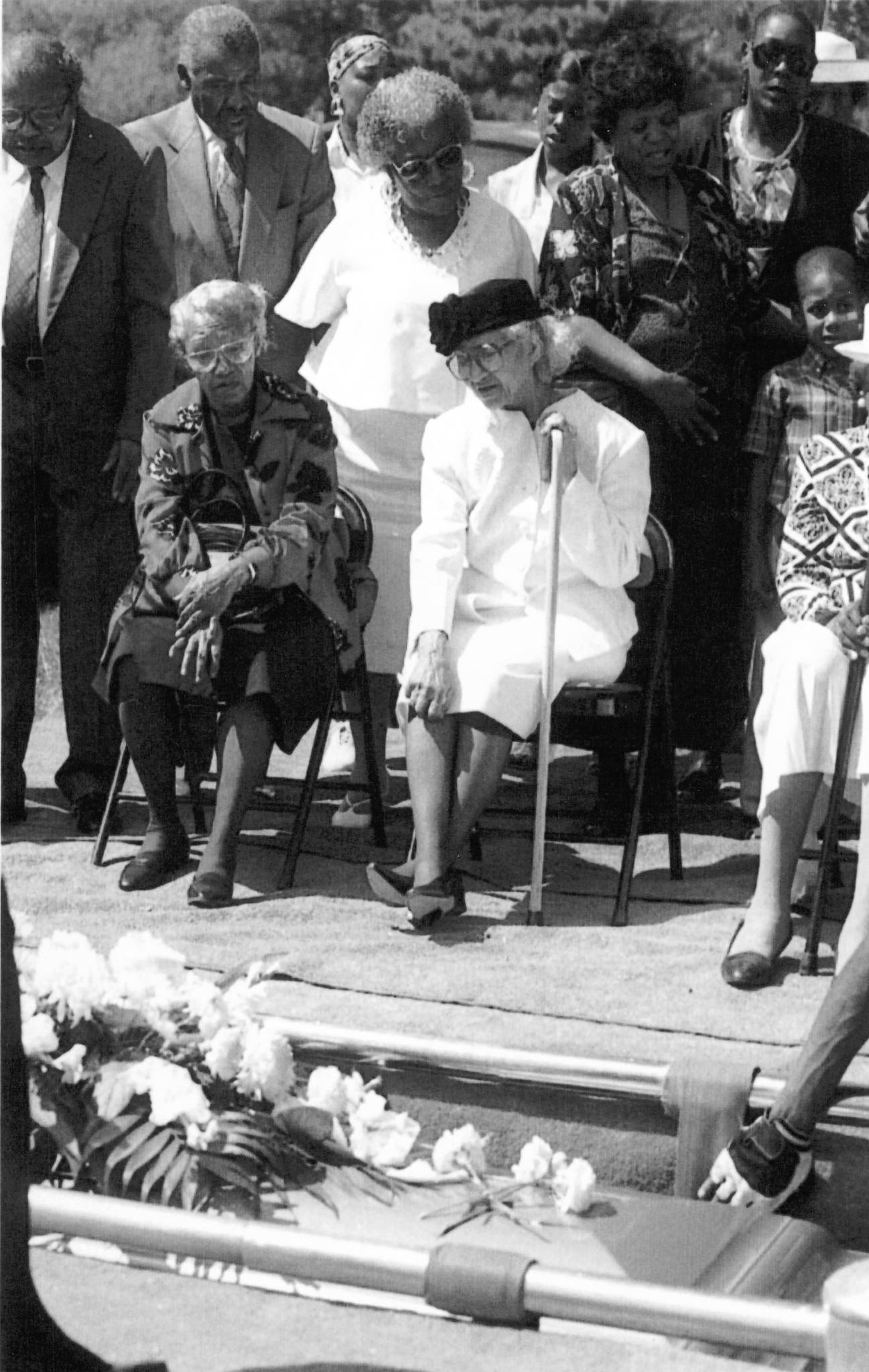 Ruby Young, center, watches as her husband, Earnest, 92, is...