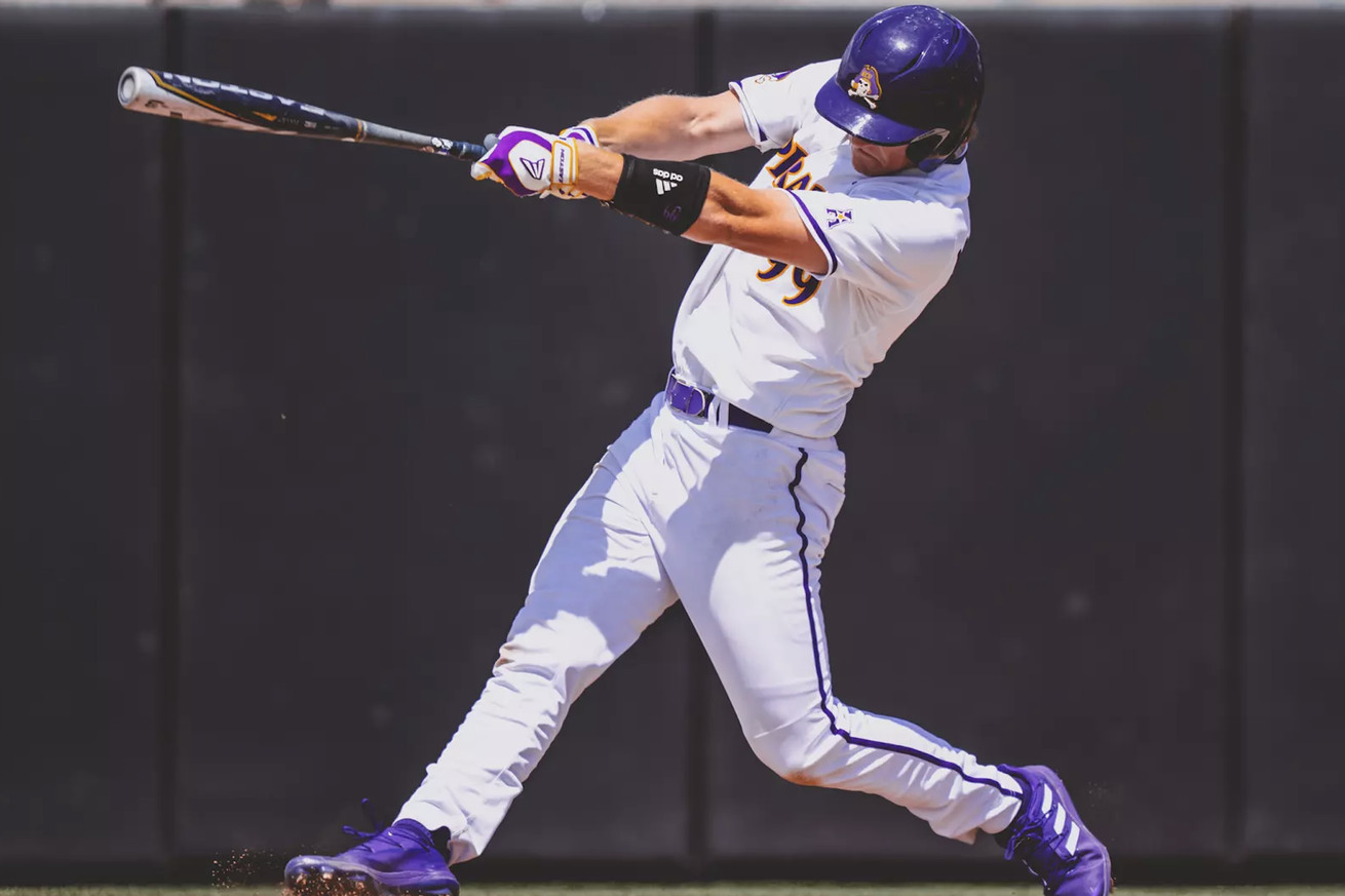 Alec Makarewicz swinging up to bat at East Carolina University.