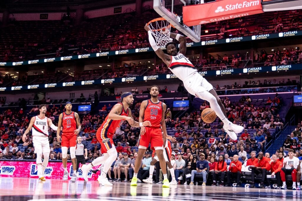 Nov 4, 2024; New Orleans, Louisiana, USA; Portland Trail Blazers center Deandre Ayton (2) dunks the ball against New Orleans Pelicans forward Jeremiah Robinson-Earl (50) and guard Jose Alvarado (15) during the first half at Smoothie King Center. Mandatory Credit: Stephen Lew-Imagn Images