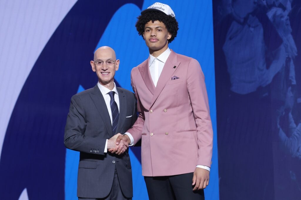 Joan Beringer stands with NBA commissioner Adam Silver after being selected as the 17th pick by the Minnesota Timberwolves in the first round of the 2025 NBA Draft at Barclays Center.