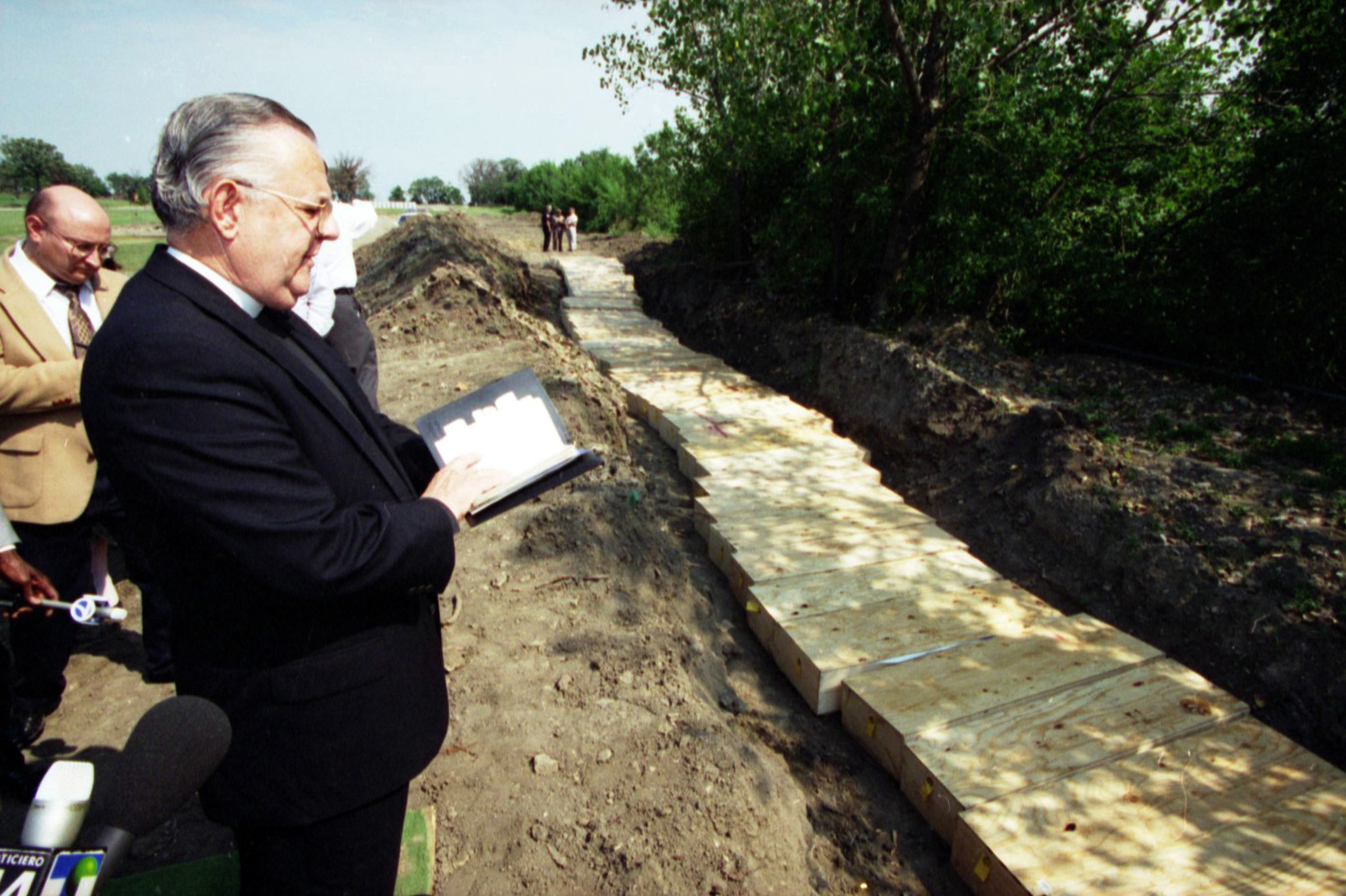 The mass burial of 68 unclaimed bodies, including 41 people...