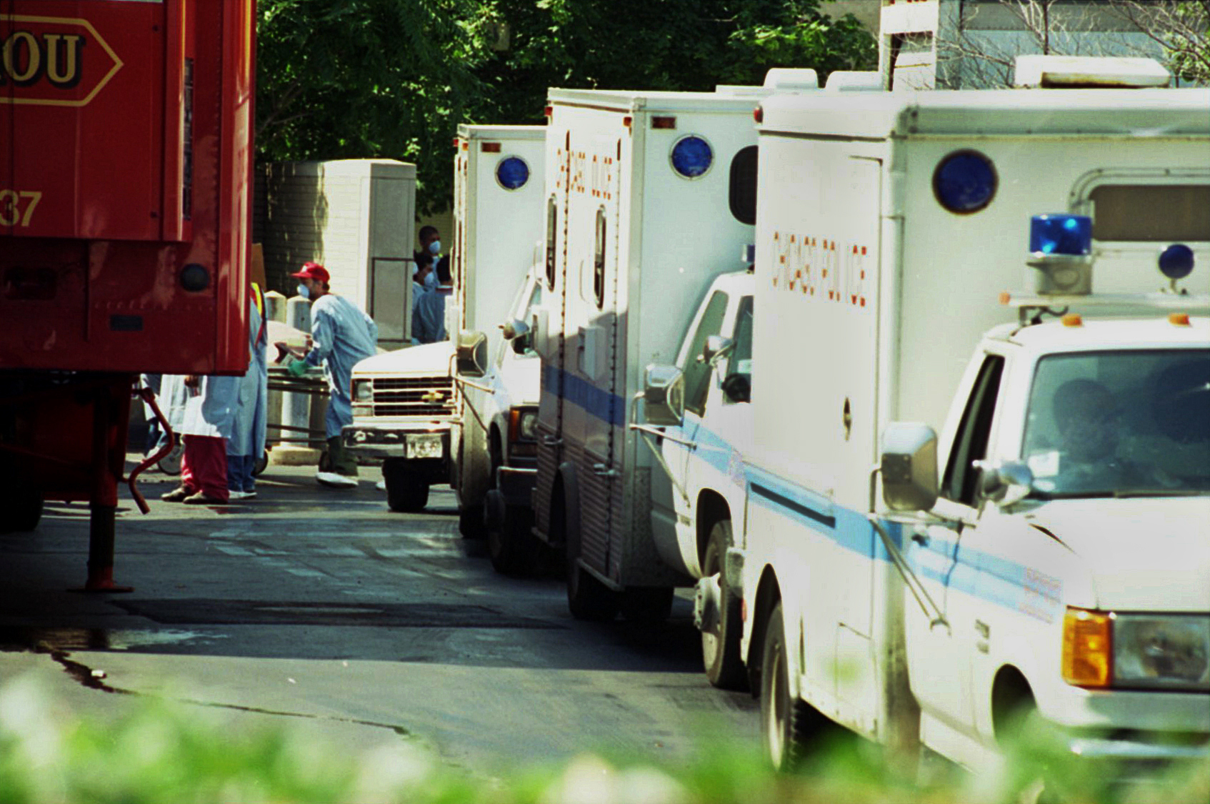 Chicago police wagons line up waiting to leave their cargos...