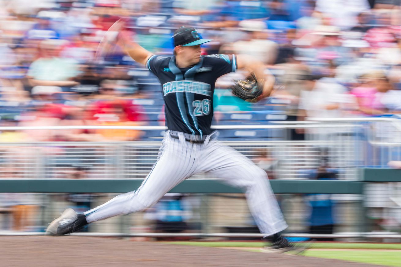 Coastal Carolina Chanticleers starting pitcher Riley Eikhoff (26) pitches against the Louisville Cardinals during the fourth inning at Charles Schwab Field.