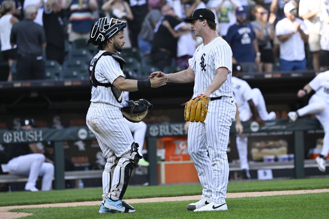 Chicago White Sox relief pitcher Grant Taylor (31) and catcher Edgar Quero (7)(left) celebrate the win after the game against the San Francisco Giants at Rate Field.