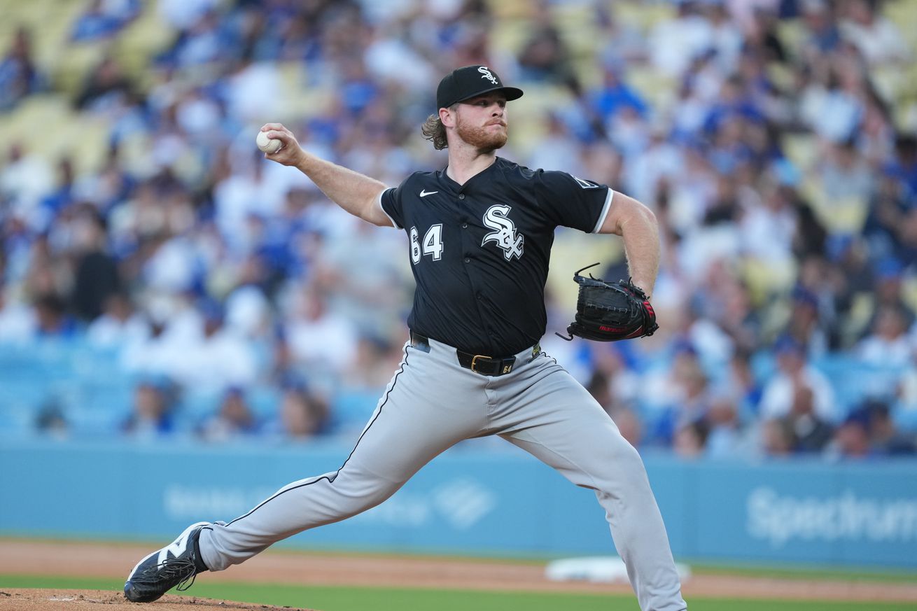 Chicago White Sox starting pitcher Shane Smith (64) throws during the first inning against the Los Angeles Dodgers at Dodger Stadium.