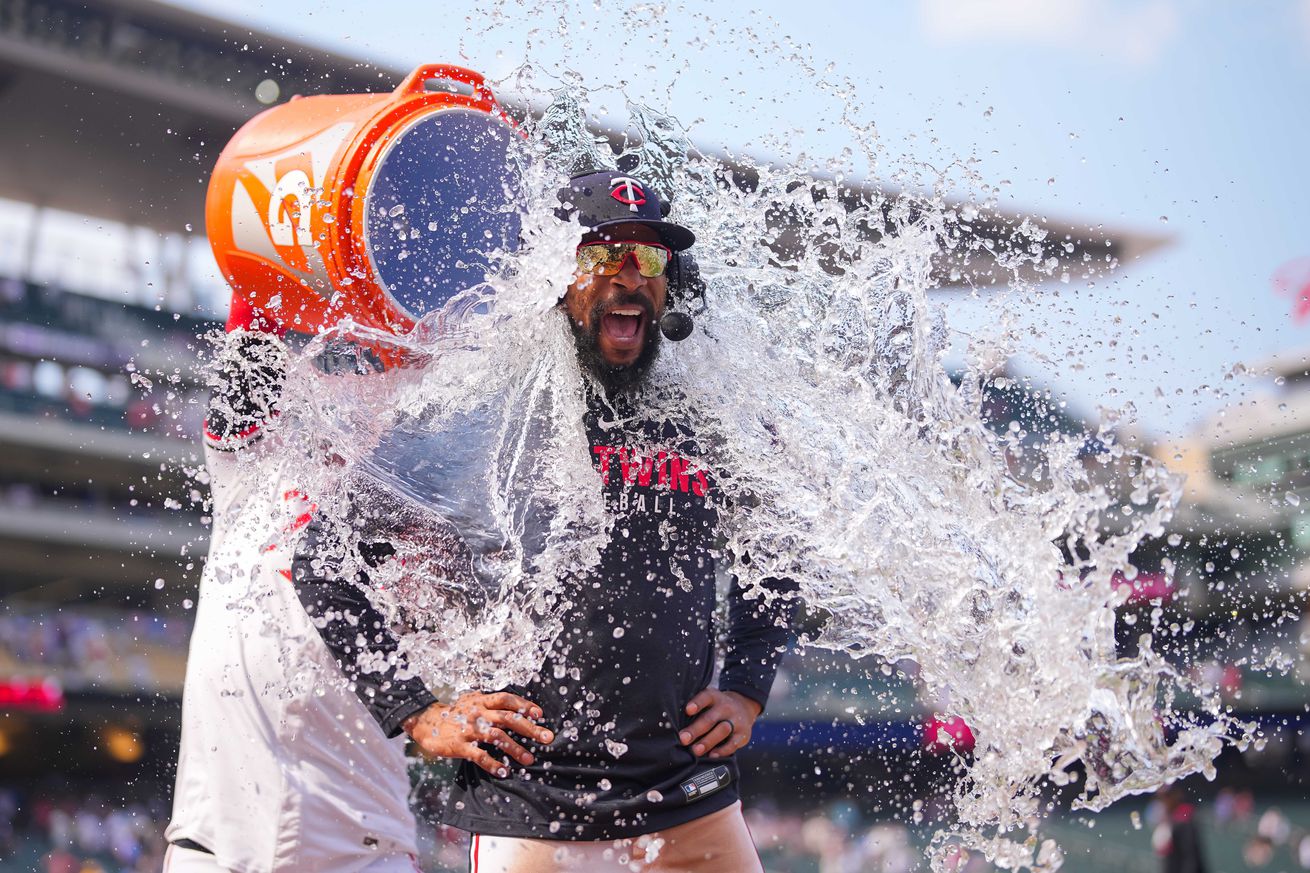 Minnesota Twins outfielder Byron Buxton (25) has water dumped on him after hitting for the cycle after the game against the Pittsburgh Pirates at Target Field.