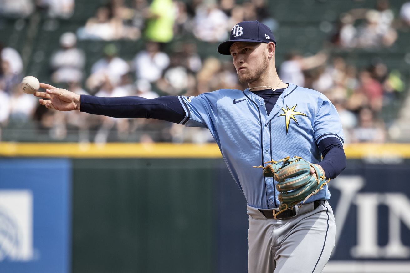 Curtis Mead #25 of the Tampa Bay Rays throws the ball towards first base in the fifth inning against the Chicago White Sox at Guaranteed Rate Field on April 28, 2024 in Chicago, Illinois.