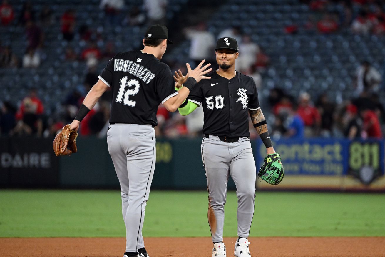 Chicago White Sox second baseman Lenyn Sosa (50) and shortstop Colson Montgomery (12) celebrate on the field after the White Sox defeated the Los Angeles Angels 6 to 3 in an MLB baseball game played on August 1, 2025 at Angel Stadium in Anaheim, CA.