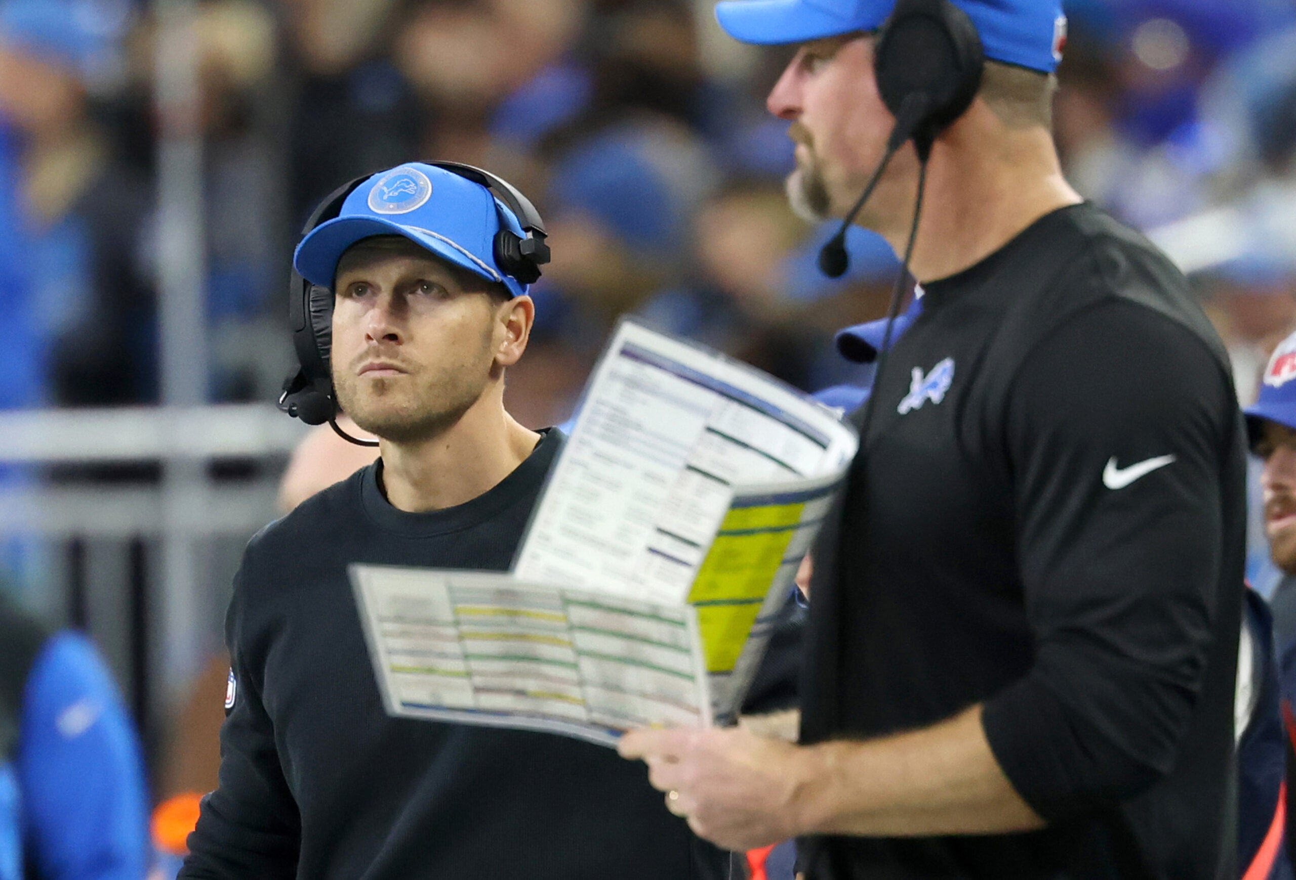Lions offensive coordinator Ben Johnson, left, works alongside Lions head...