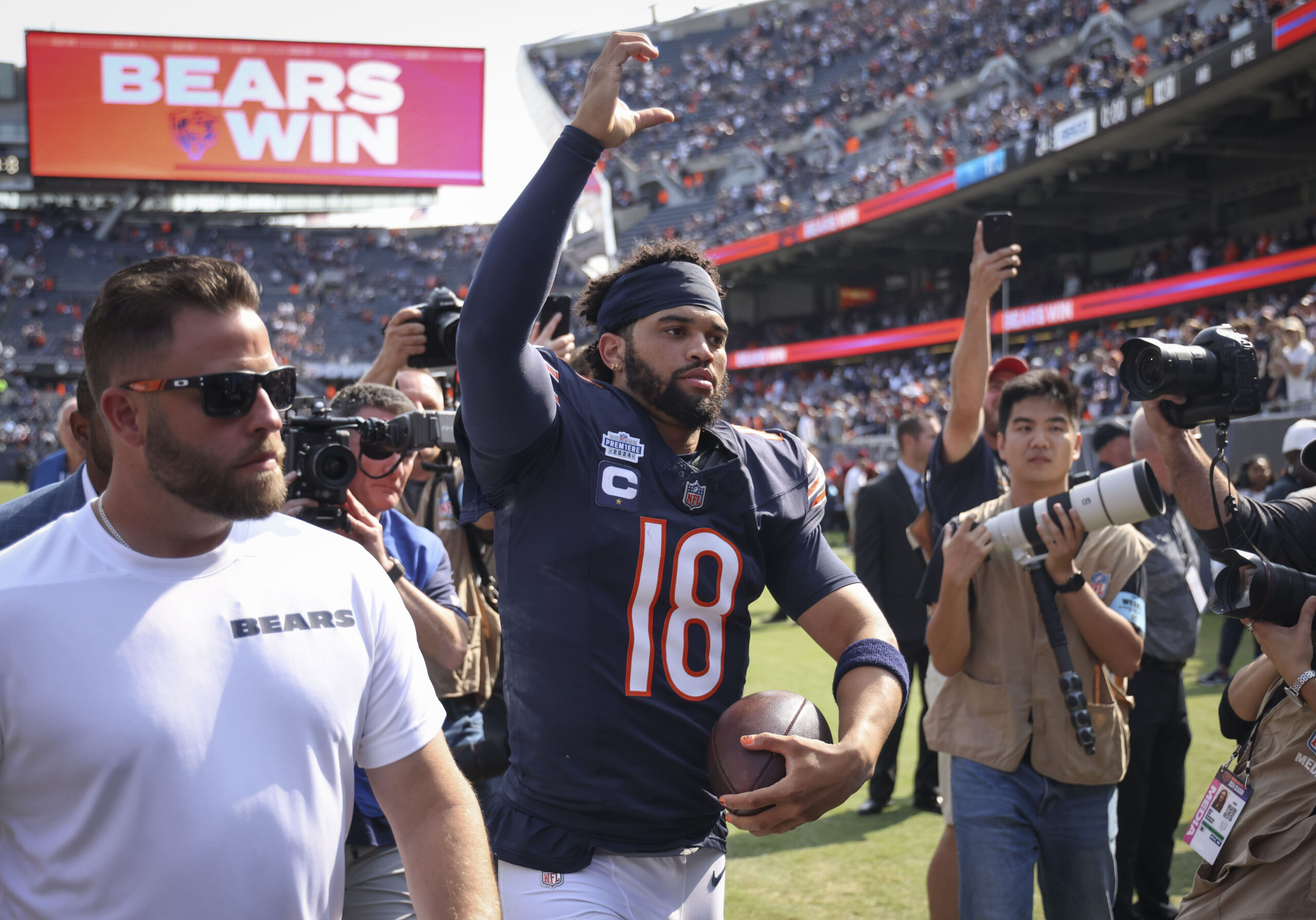 Bears quarterback Caleb Williams celebrates his first career win on...