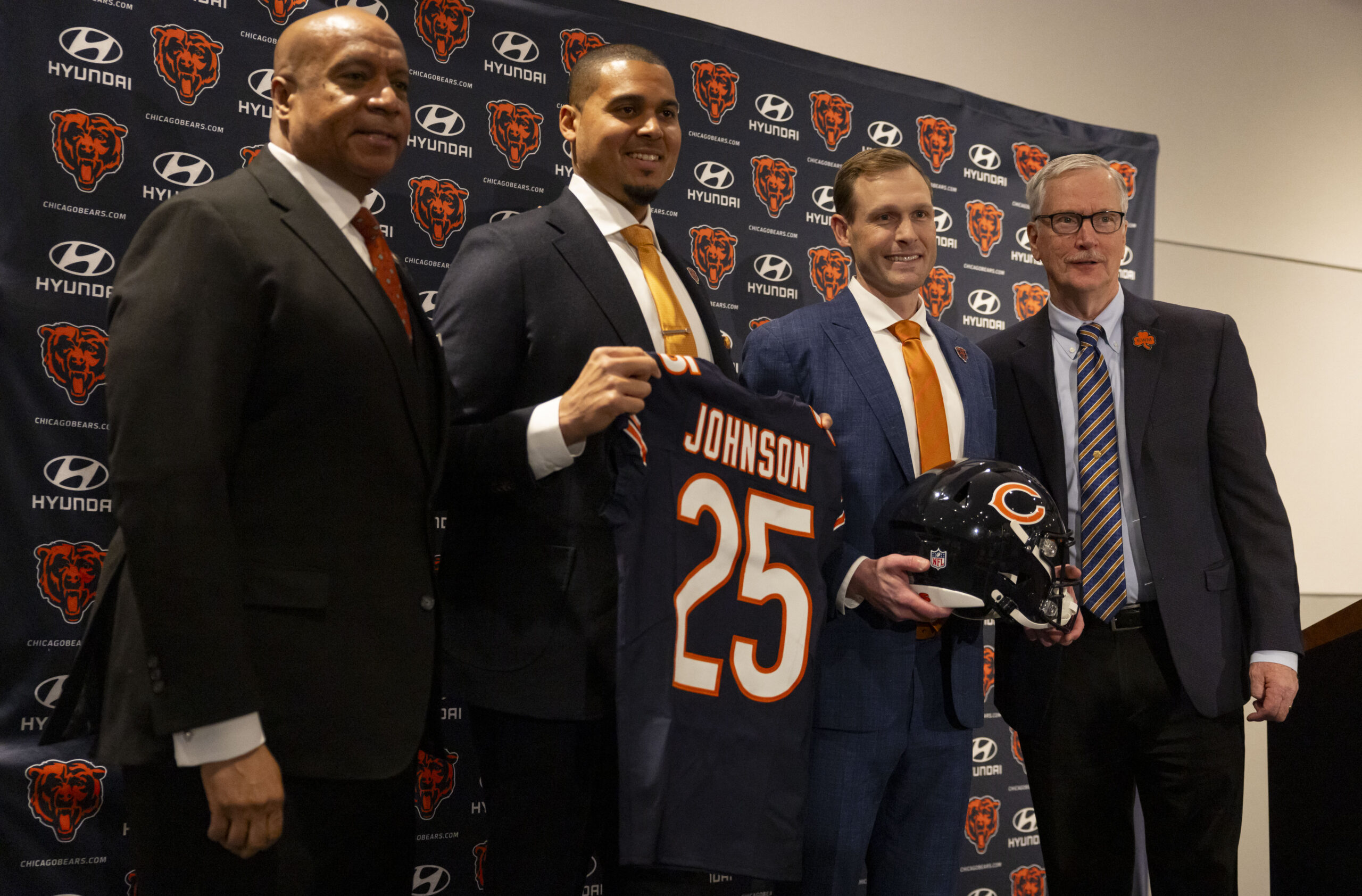 New Bears coach Ben Johnson, third from left, poses with,...