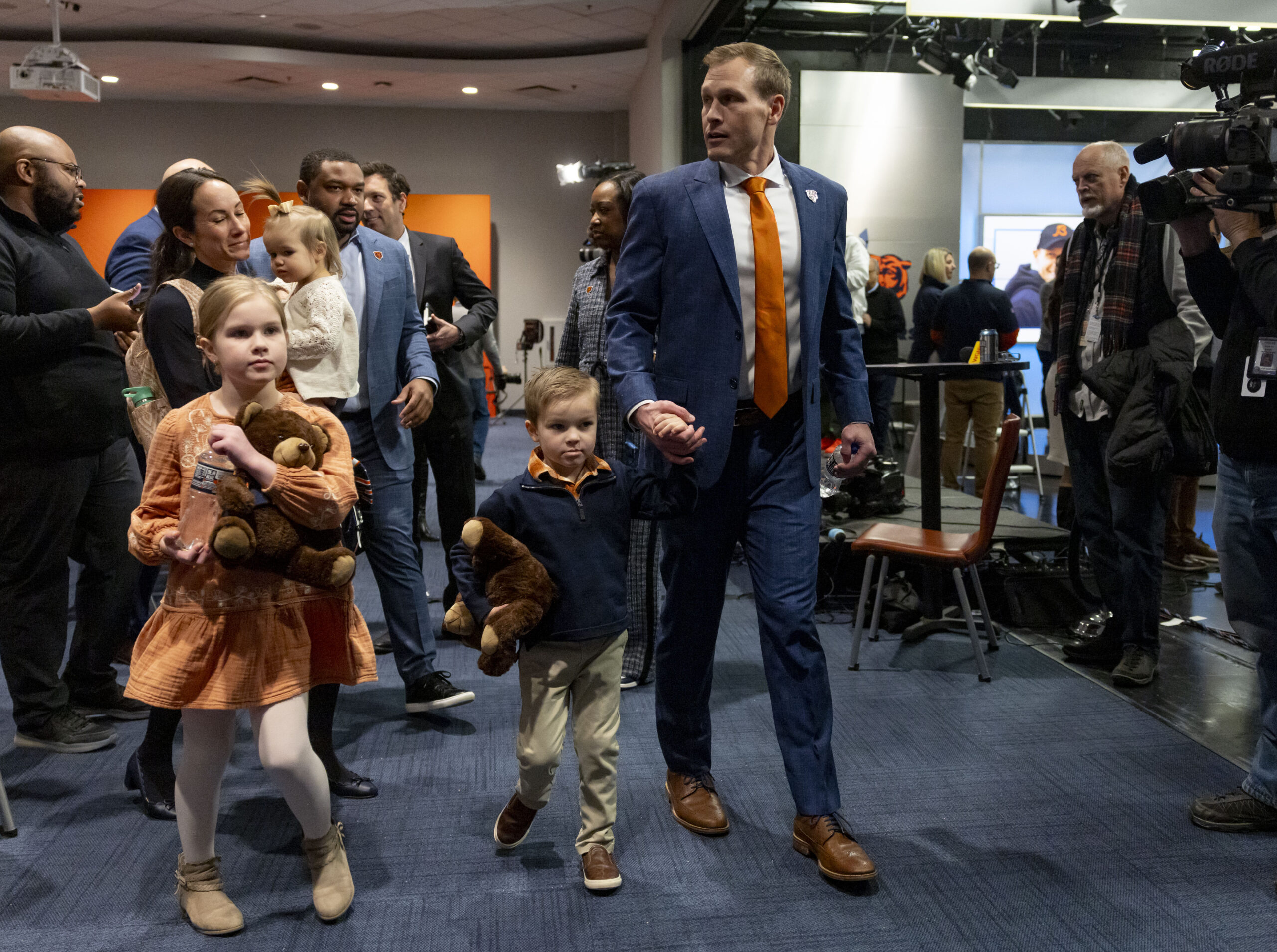 New Bears coach Ben Johnson departs with his wife, Jessica,...