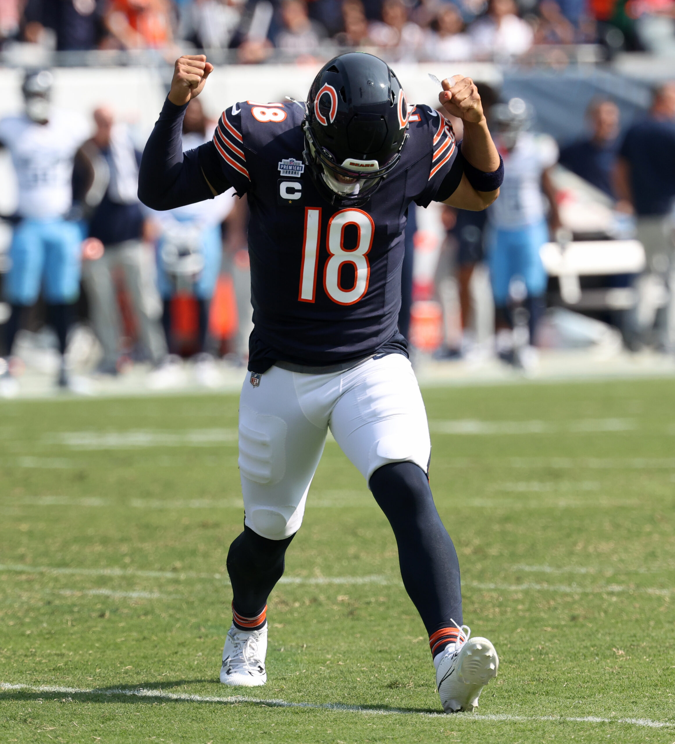 Bears quarterback Caleb Williams celebrates after completing a pass for...