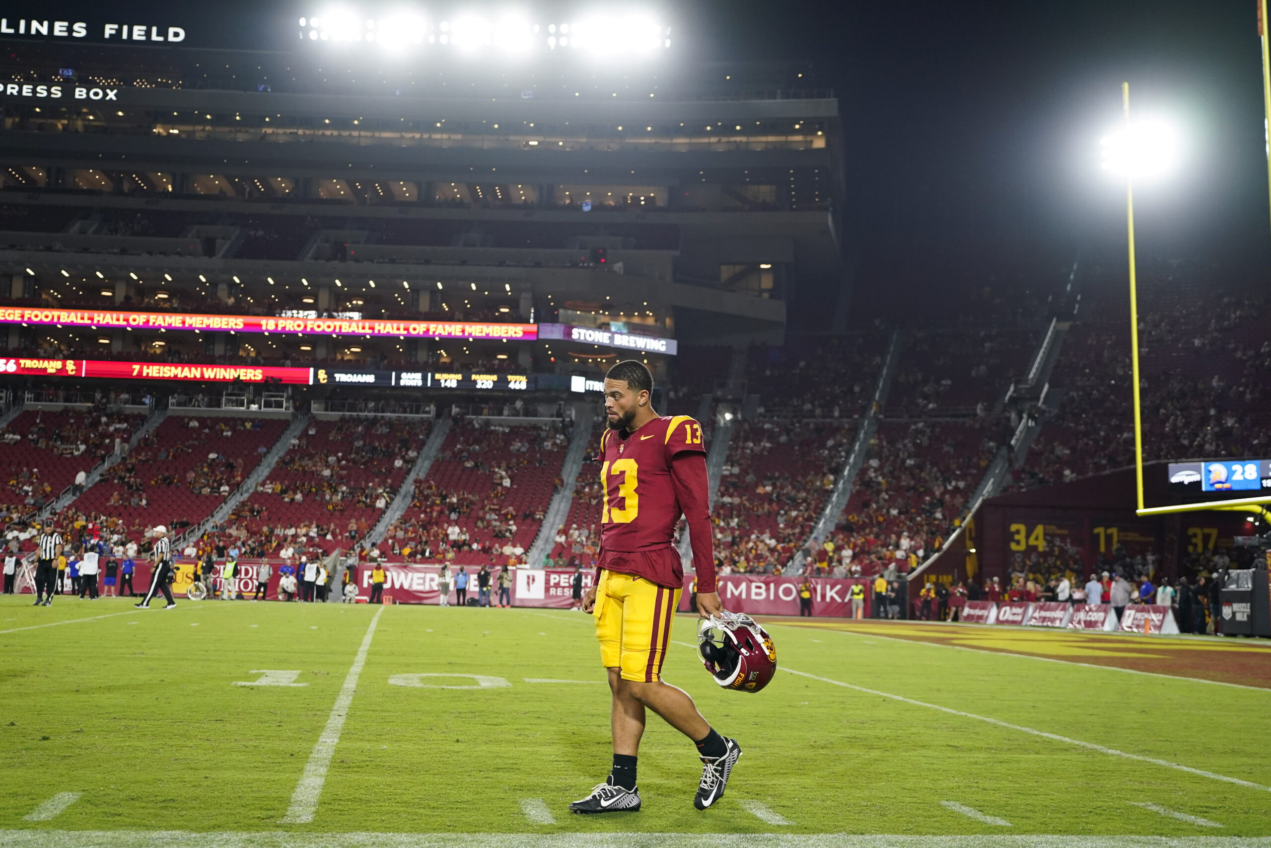 Southern California quarterback Caleb Williams walks along the sideline during...