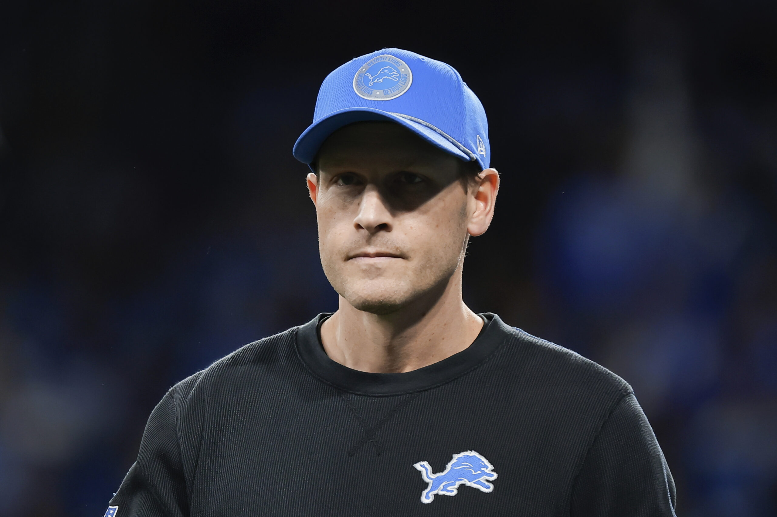 Lions offensive coordinator Ben Johnson watches during warmups before a...
