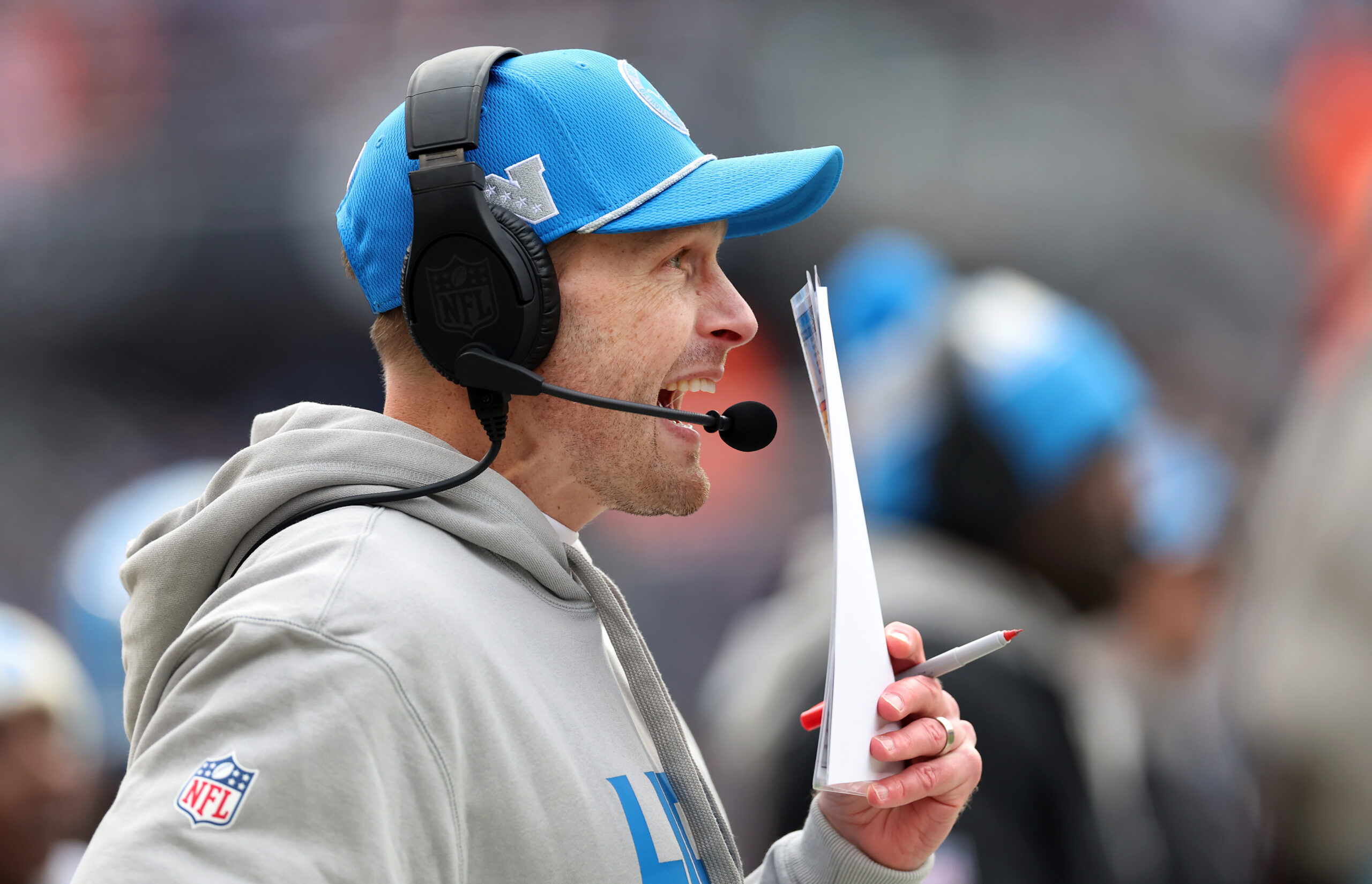 Lions offensive coordinator Ben Johnson works on the sideline against...