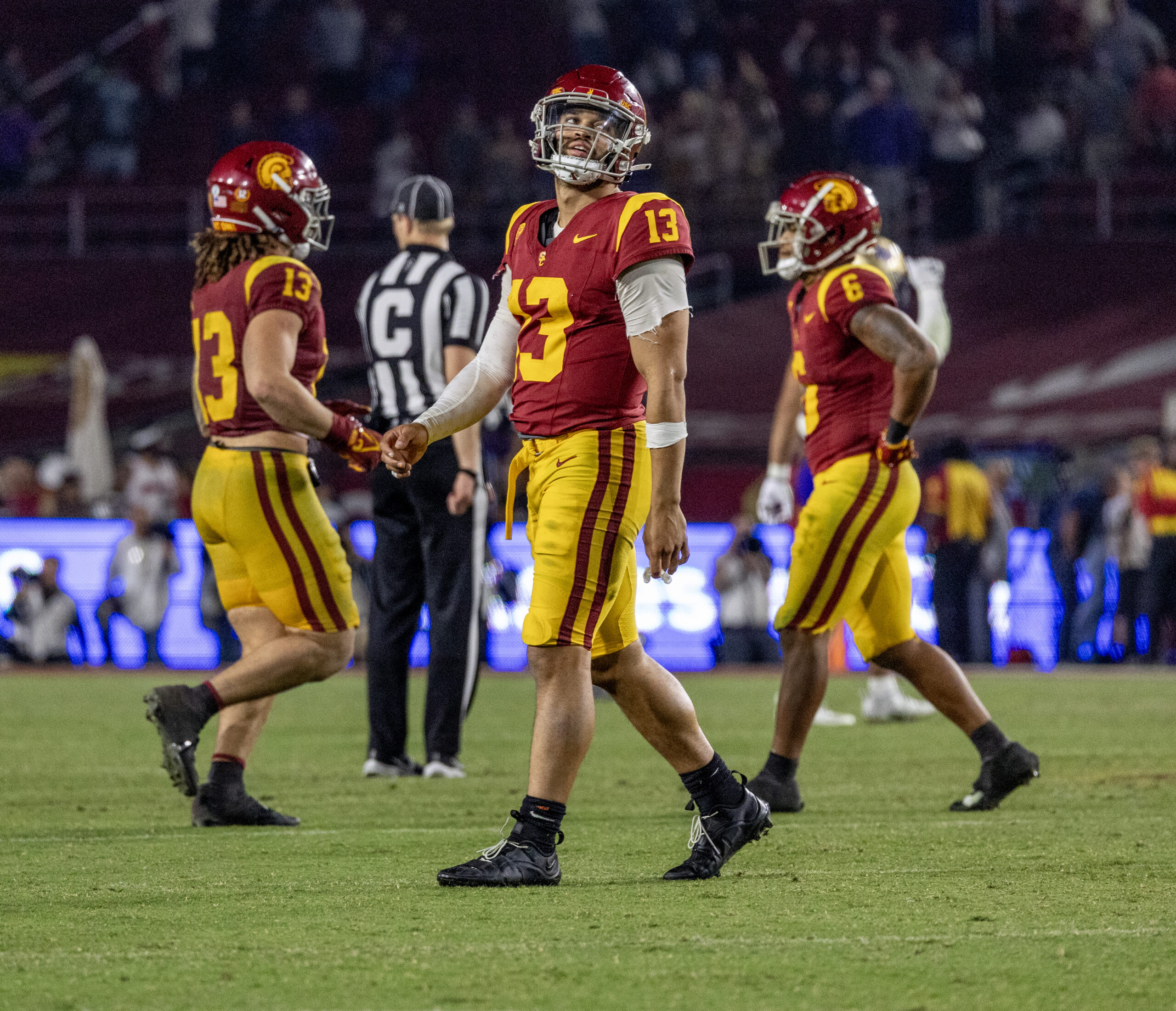 USC quarterback Caleb Williams walks off the field after the...