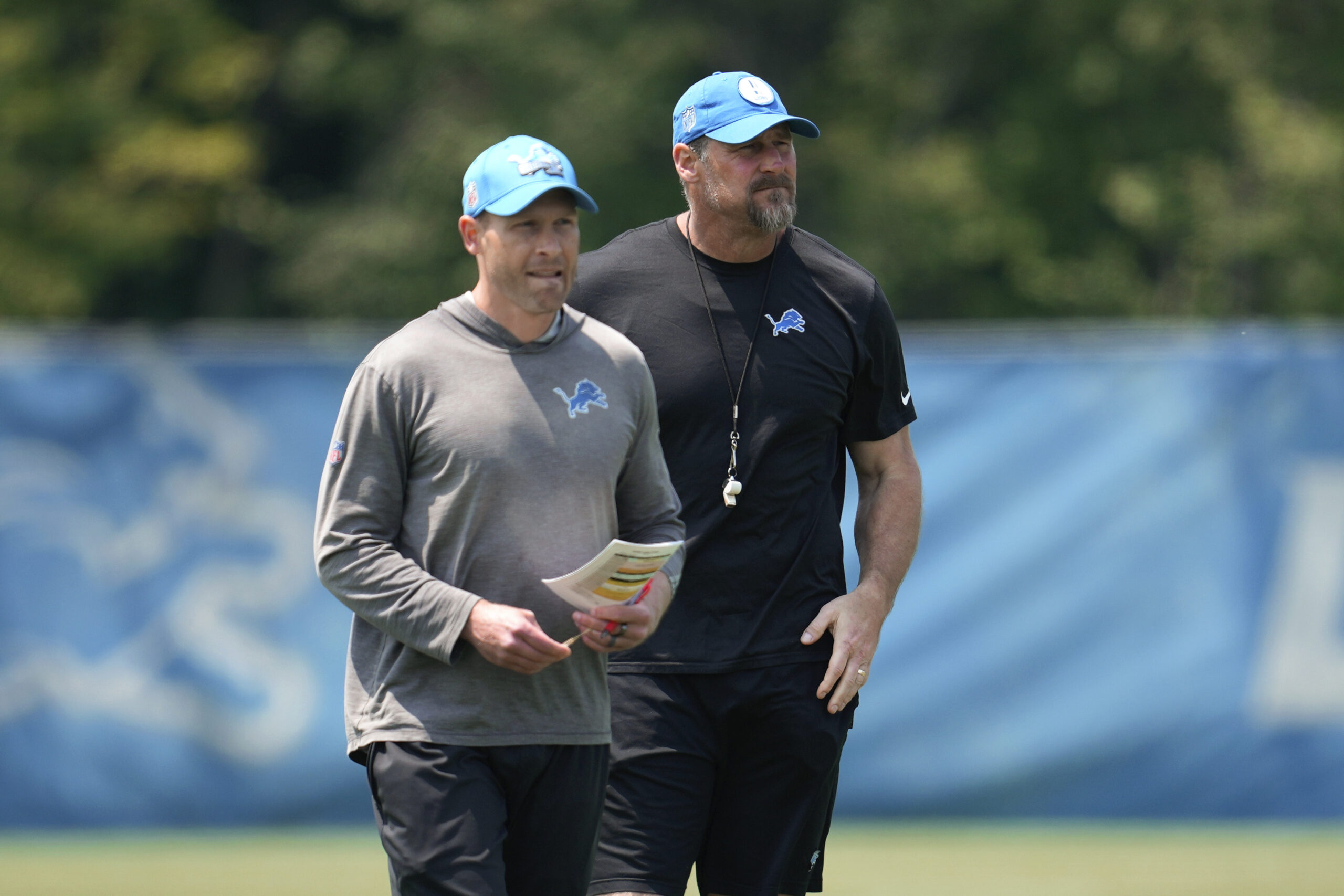 Lions offensive coordinator Ben Johnson, left, and head coach Dan...