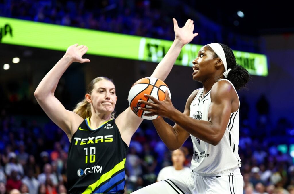 Aug 24, 2025; Arlington, Texas, USA; Golden State Valkyries guard Kaila Charles (6) shoots as Dallas Wings center Luisa Geiselsoder (18) defends during the first half at College Park Center. Mandatory Credit: Kevin Jairaj-Imagn Images