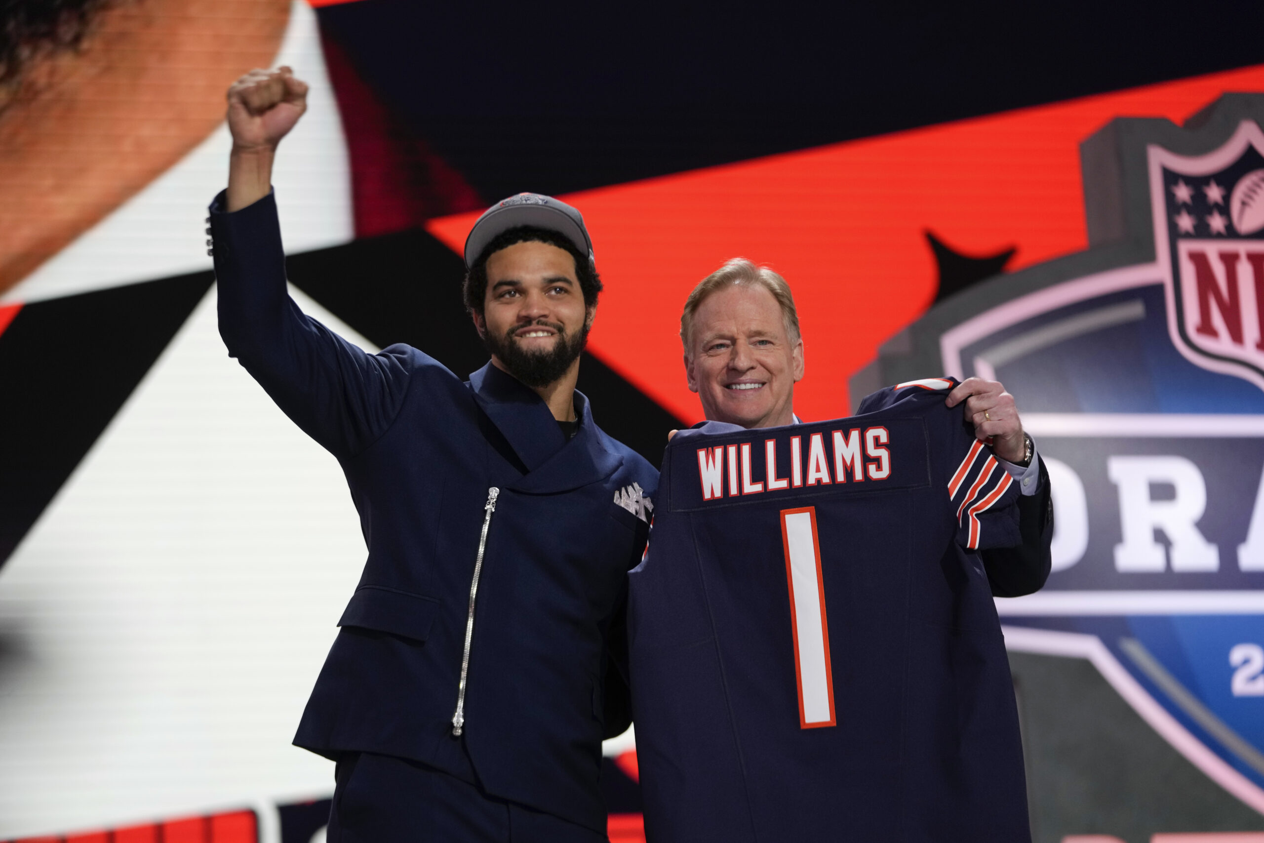 Southern California quarterback Caleb Williams celebrates with NFL commissioner Roger...