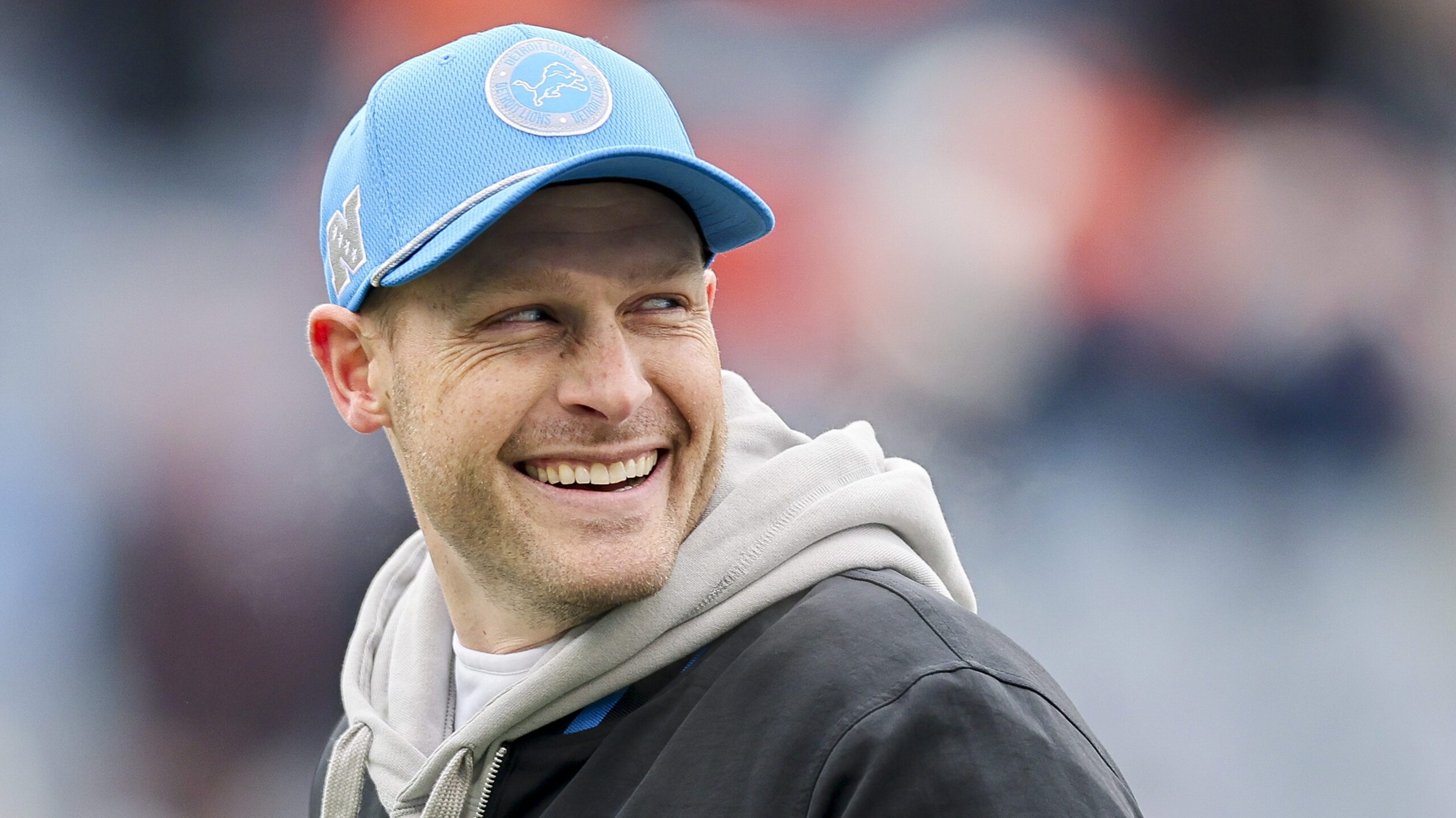 Lions offensive coordinator Ben Johnson smiles before the game against...
