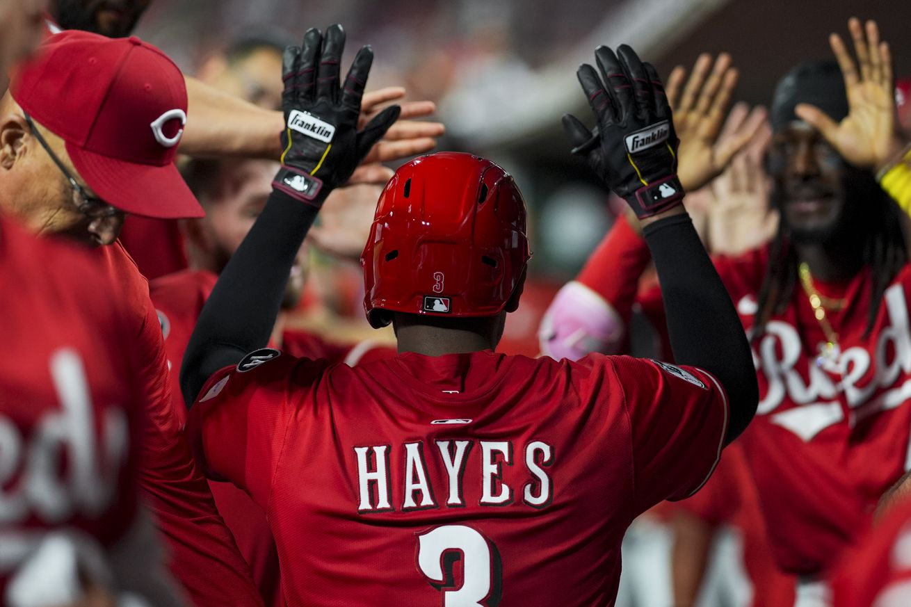 Cincinnati Reds third baseman Ke’Bryan Hayes (3) celebrates with teammates after hitting a three-run home run against the Atlanta Braves in the eighth inning at Great American Ball Park.