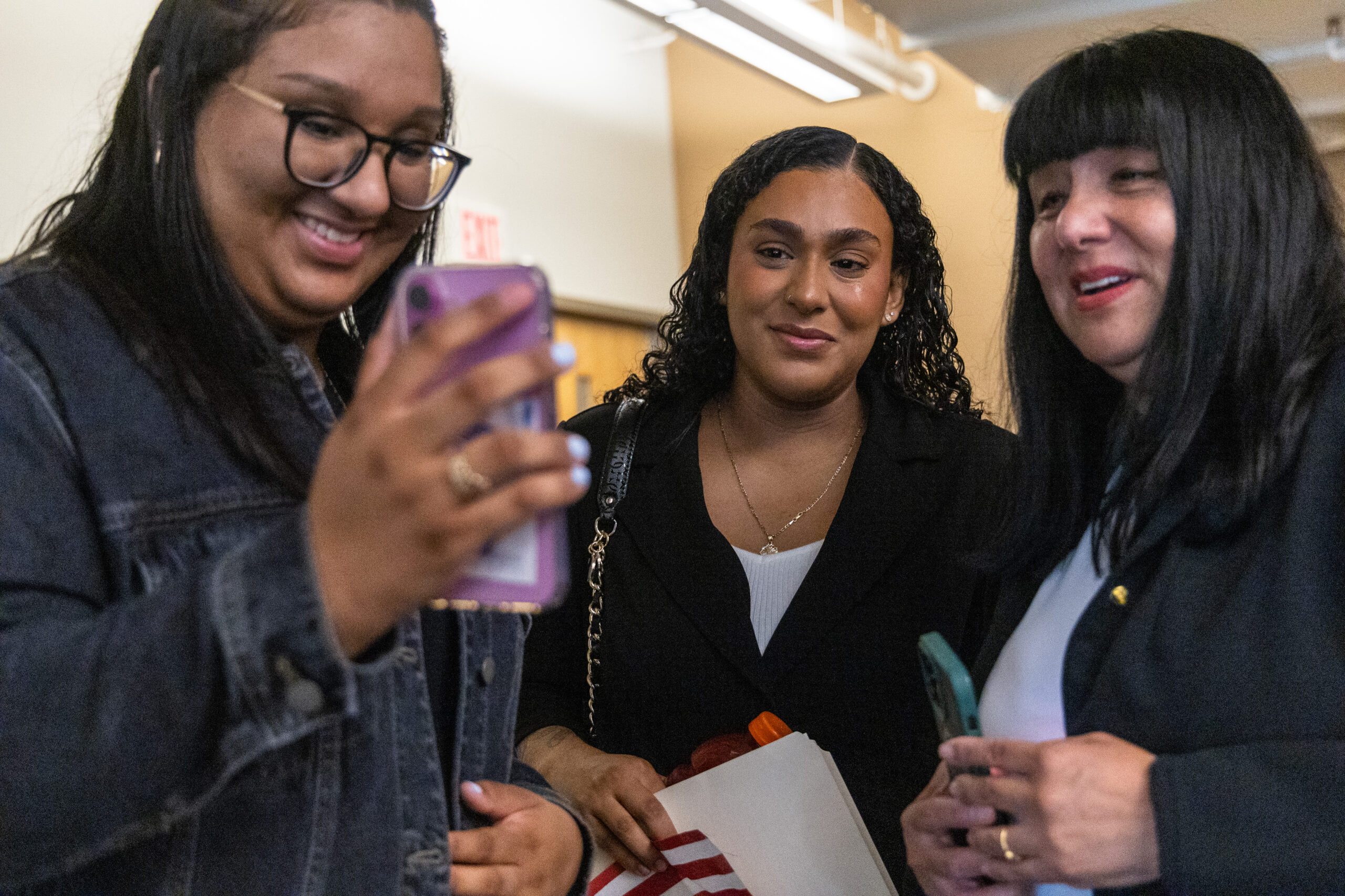 Maryori Urbina-Contreras, 24, middle, calls her mom to tell her...