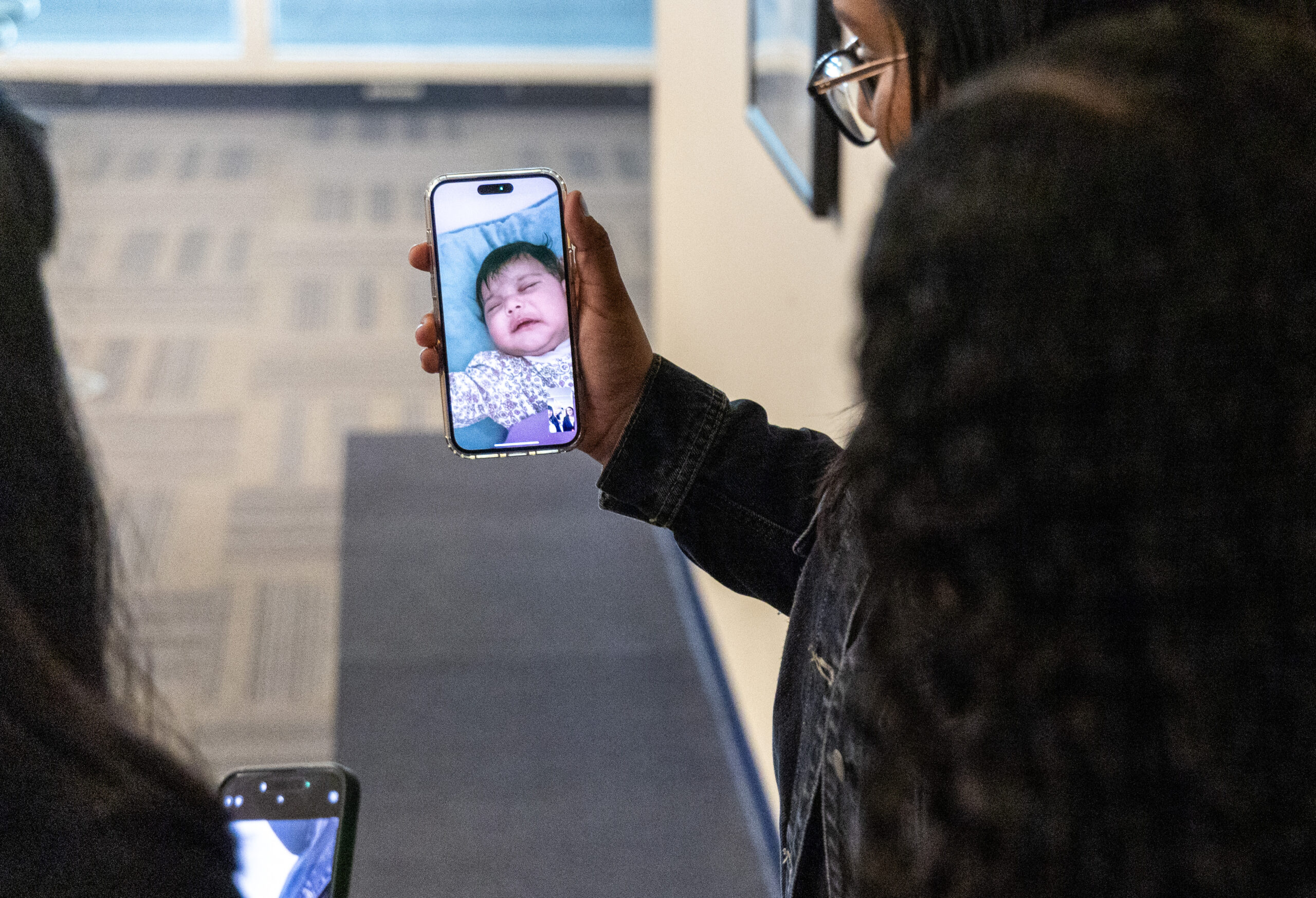 Maryori Urbina-Contreras, 24, calls her infant daughter after passing her...